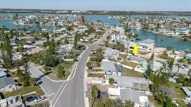 bird's eye view with a residential view and a water view