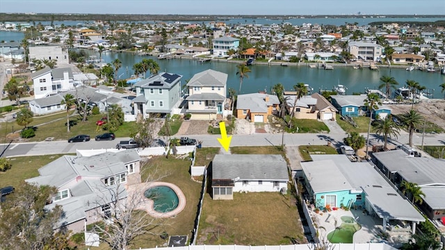 birds eye view of property featuring a residential view and a water view