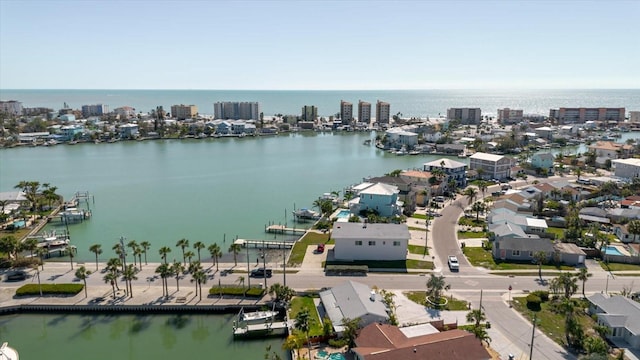 birds eye view of property with a water view and a view of city