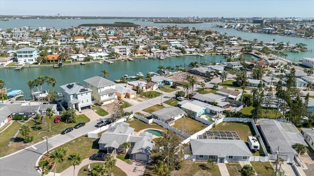 bird's eye view featuring a water view and a residential view