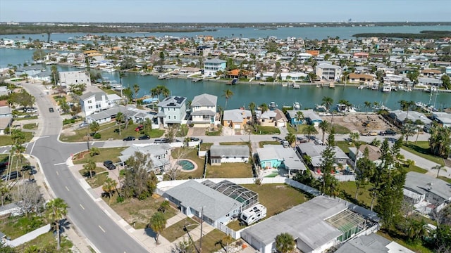 bird's eye view featuring a residential view and a water view