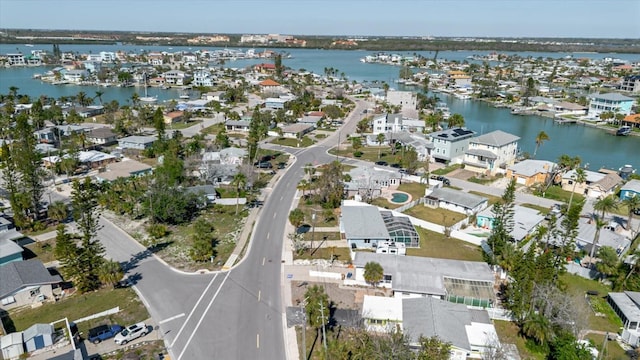 drone / aerial view with a residential view and a water view