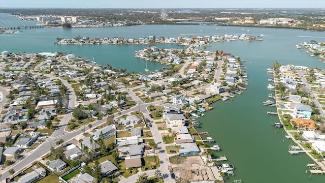 birds eye view of property featuring a water view and a residential view