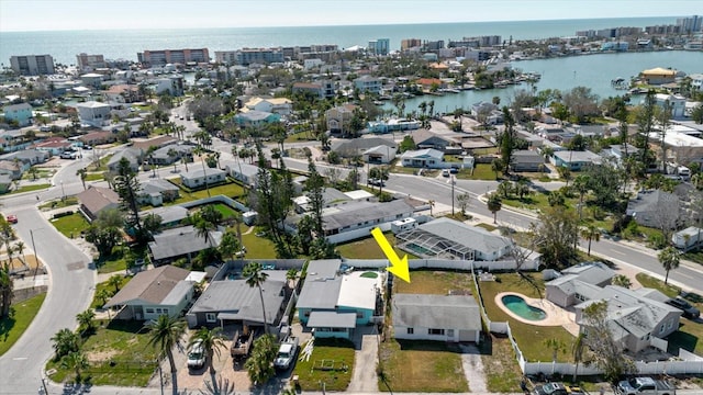 birds eye view of property featuring a water view