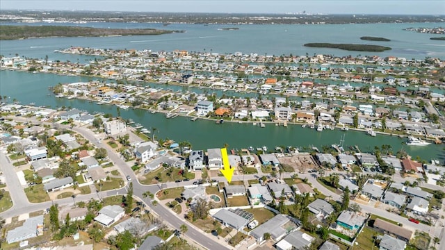 birds eye view of property with a water view and a residential view