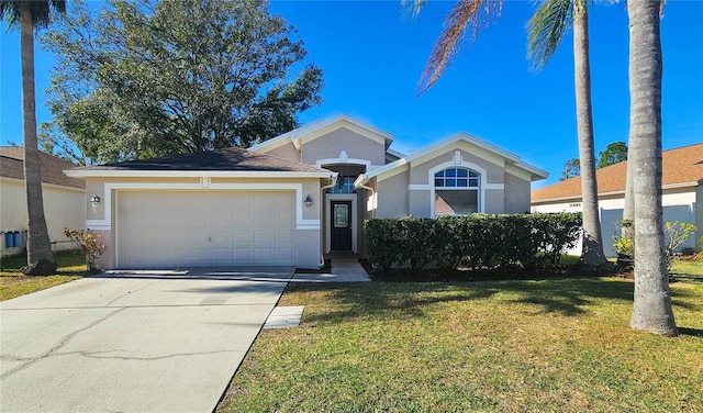 view of front of home featuring a front lawn, an attached garage, driveway, and stucco siding