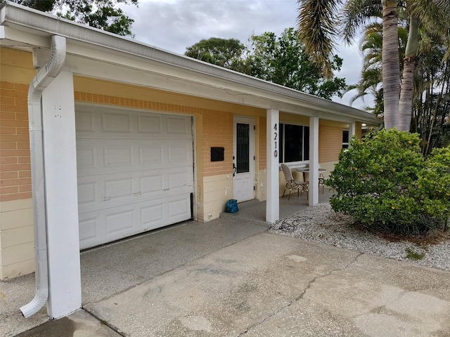 garage featuring driveway