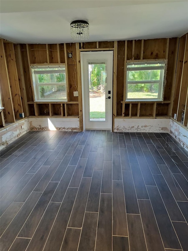 interior space featuring a healthy amount of sunlight and dark wood finished floors