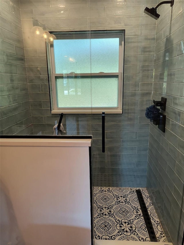 full bath with a tile shower