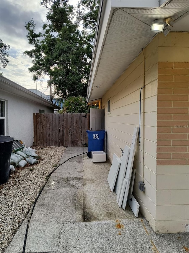 view of side of home with fence