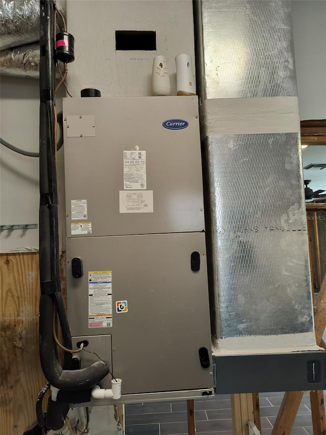 utility room with heating unit