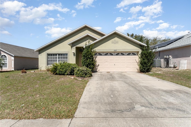 ranch-style home with stucco siding, a front lawn, cooling unit, concrete driveway, and a garage