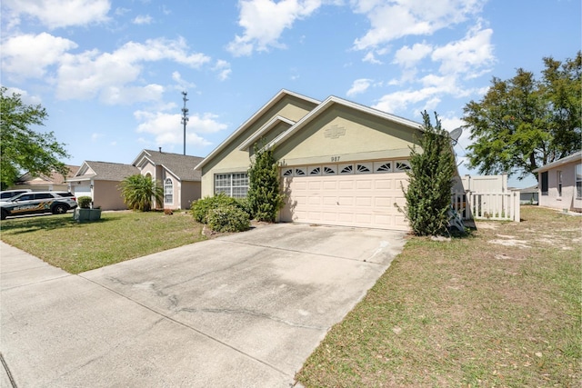 ranch-style home with a front yard, a garage, driveway, and stucco siding