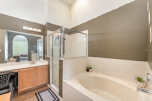 full bathroom with vanity, ensuite bath, a bath, and a stall shower