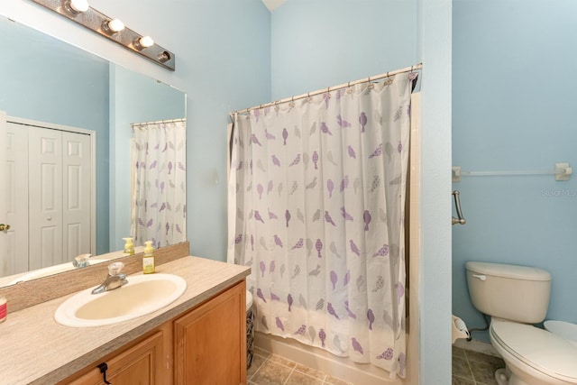 bathroom with tile patterned floors, toilet, shower / tub combo with curtain, and vanity