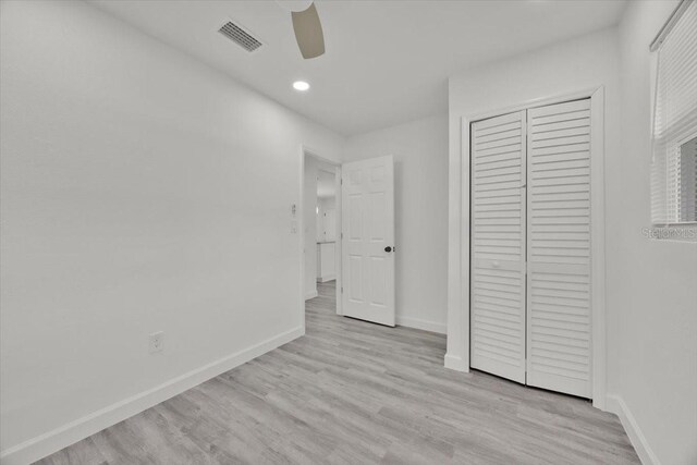 2415 Sutton Rd, Lakeland, FL 33810 - unfurnished bedroom featuring baseboards, recessed lighting, a closet, and light wood-type flooring