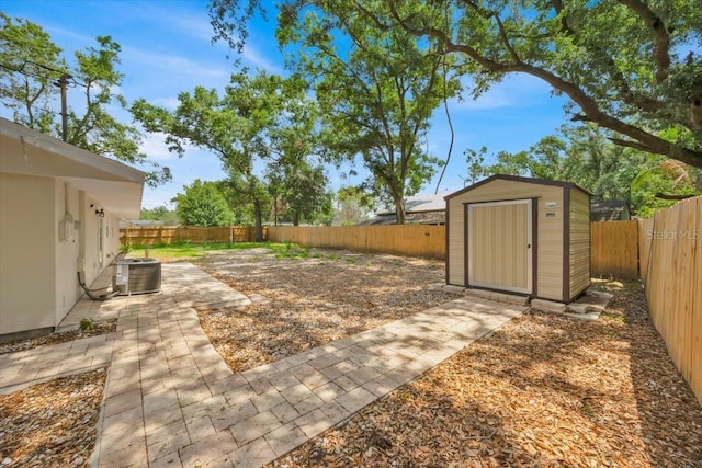 2415 Sutton Rd, Lakeland, FL 33810 - fenced backyard with a storage shed, central air condition unit, a patio area, and an outdoor structure