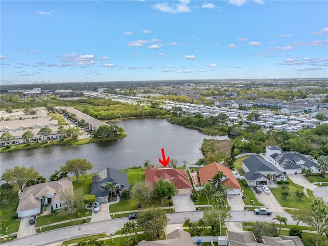 aerial view featuring a residential view and a water view