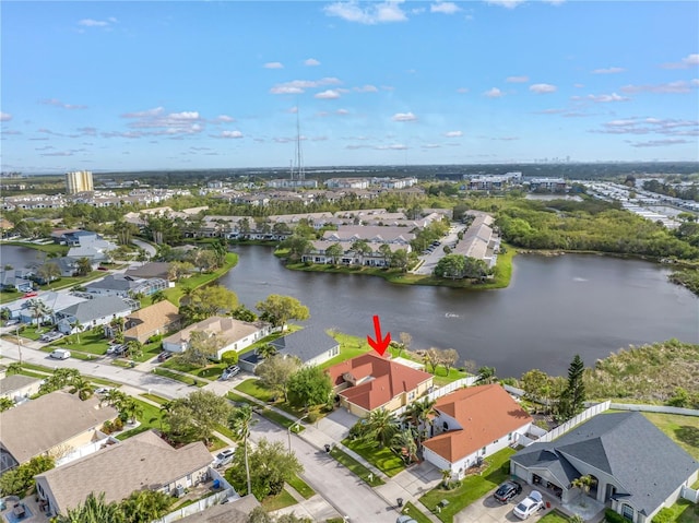 bird's eye view with a residential view and a water view