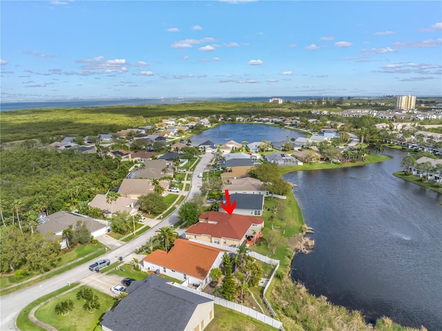 bird's eye view featuring a residential view and a water view