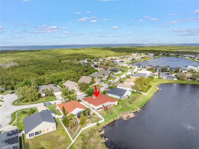 bird's eye view with a residential view and a water view