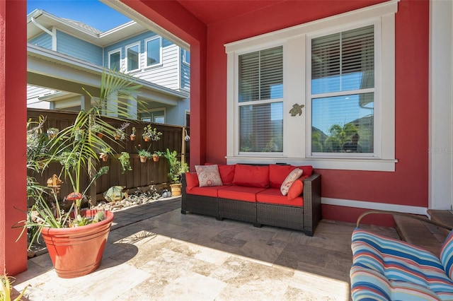 view of patio / terrace featuring an outdoor hangout area and fence