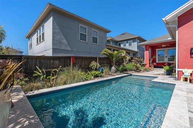 view of pool featuring a patio area, a fenced in pool, ceiling fan, and fence