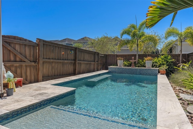 view of pool with a patio area, a fenced in pool, and a fenced backyard