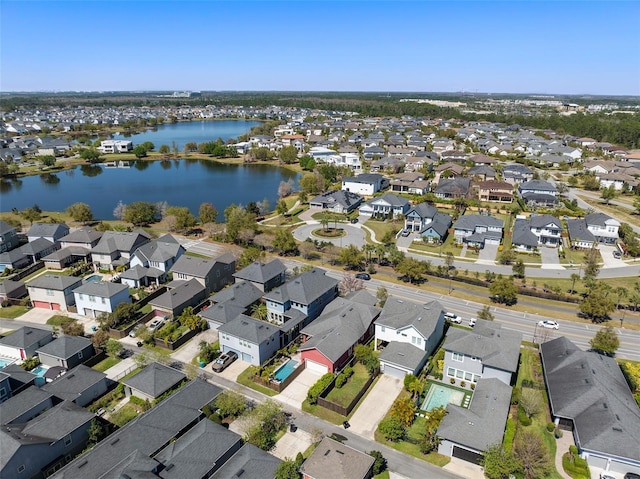 aerial view featuring a residential view and a water view