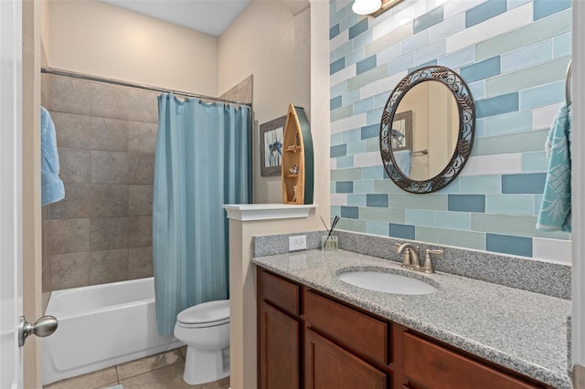 bathroom with shower / bath combo with shower curtain, toilet, vanity, and tile patterned flooring