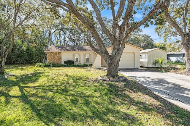 ranch-style home featuring a front yard, an attached garage, stucco siding, concrete driveway, and stone siding