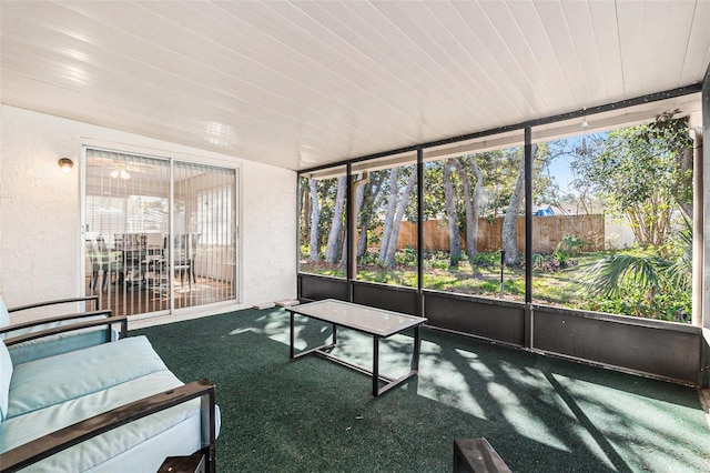 sunroom featuring wood ceiling