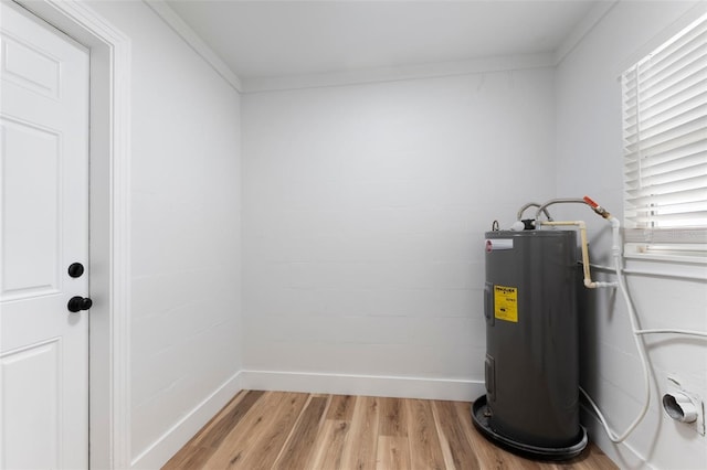 utility room featuring electric water heater