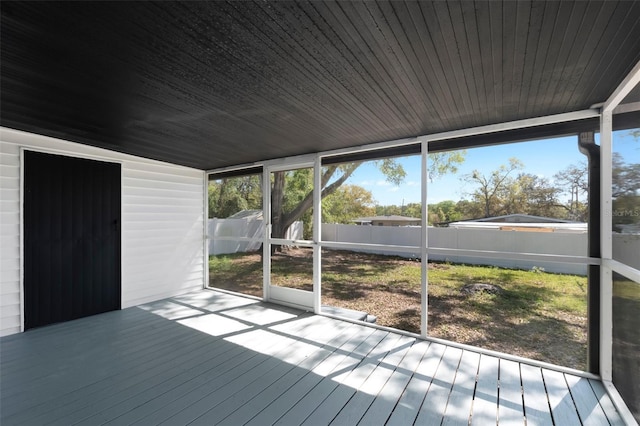 unfurnished sunroom featuring wooden ceiling