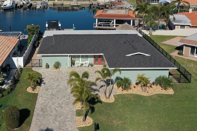 birds eye view of property with a water view