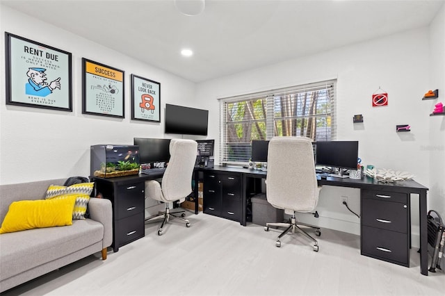 office space with recessed lighting and wood finished floors