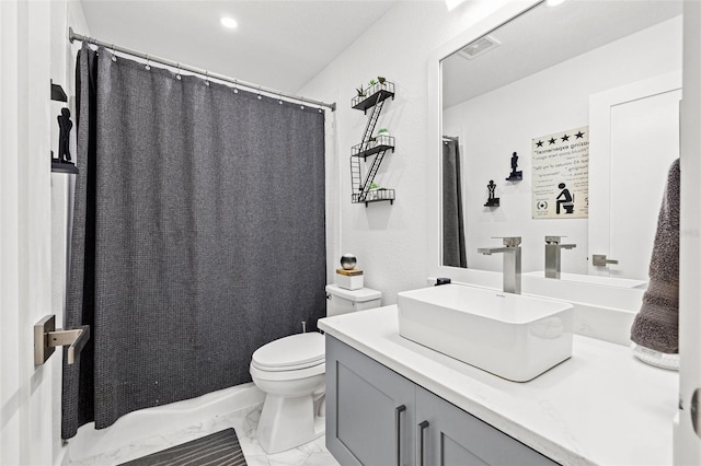 bathroom with visible vents, toilet, marble finish floor, and vanity