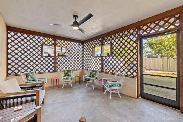 sunroom with ceiling fan