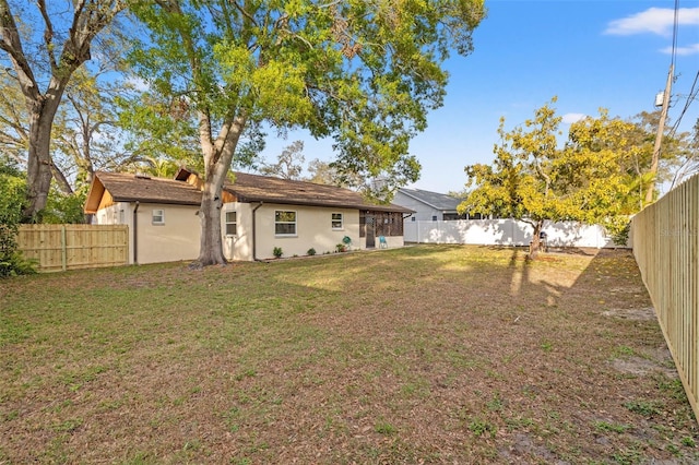 view of yard with a fenced backyard