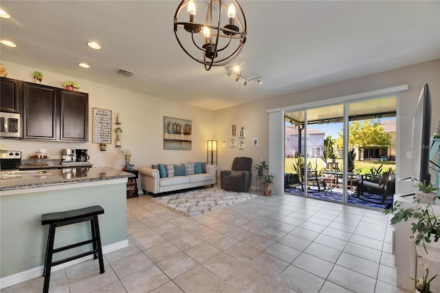 living room featuring light tile patterned floors, visible vents, an inviting chandelier, and recessed lighting