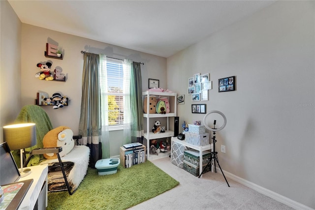 interior space with baseboards and carpet flooring