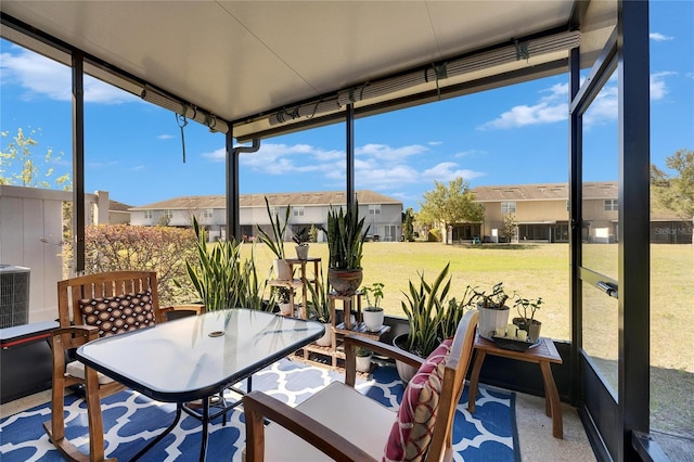 sunroom with a residential view