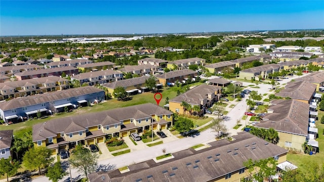 birds eye view of property with a residential view