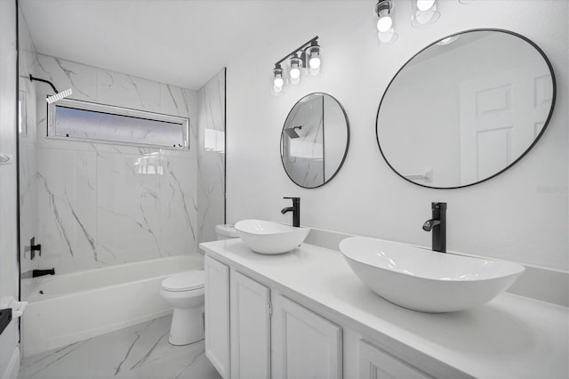 full bathroom with bathtub / shower combination, double vanity, marble finish floor, and a sink