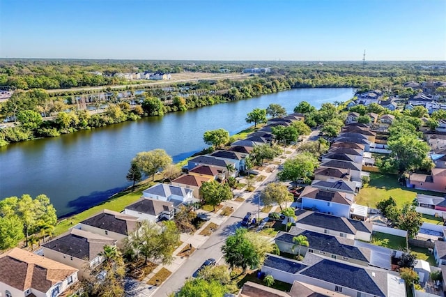 drone / aerial view featuring a residential view and a water view