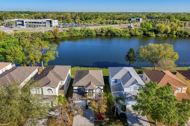 birds eye view of property featuring a residential view and a water view