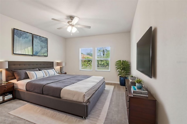 bedroom with light colored carpet and ceiling fan