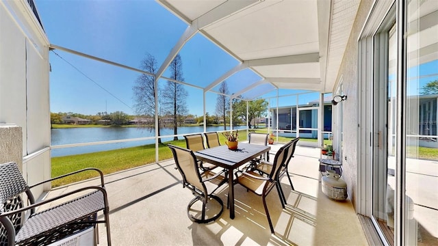 sunroom / solarium featuring a healthy amount of sunlight and a water view