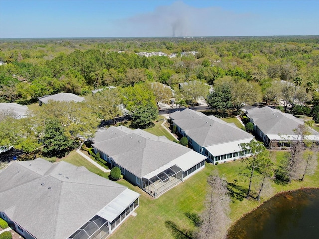 aerial view featuring a residential view and a wooded view