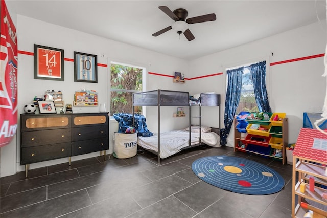 bedroom with tile patterned floors and ceiling fan